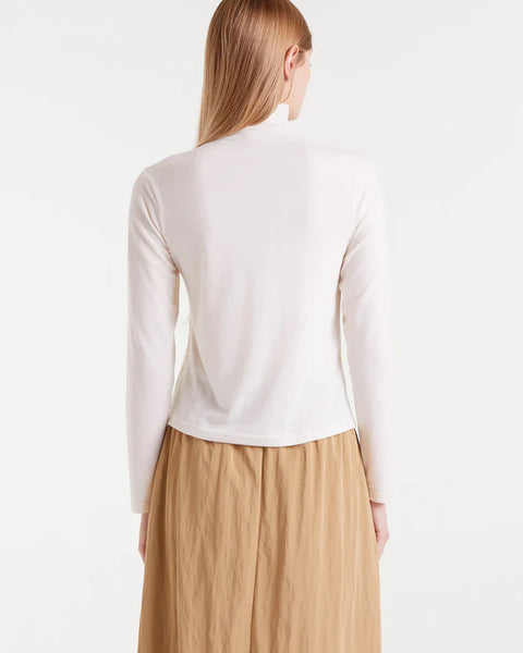 Ivory high-neck top for women with long sleeves for elegant minimalist fashion, office outfits, and everyday layering.