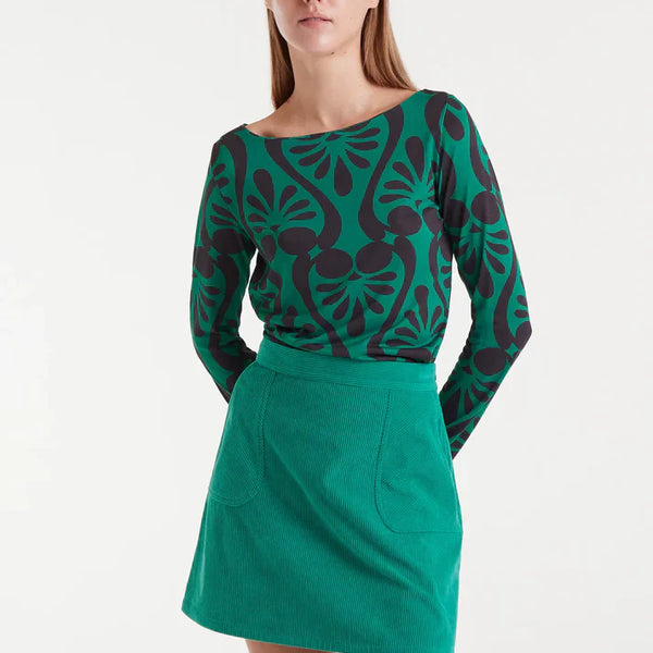 Women’s green and black abstract print top with long sleeves and boat neckline for bold statement outfits and modern everyday style.