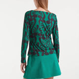 Women’s retro print top in green and black with long sleeves for colorful maximalist outfits and modern statement dressing.