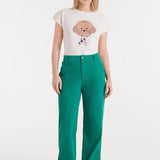 White graphic T-shirt for women with cute dog illustration and short sleeves for casual street style and weekend wear.