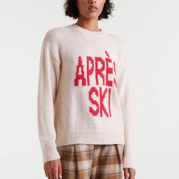 Women's Après Ski sweater in cream with bold red graphic lettering, cozy crew neck knit for winter and ski resort outfits.