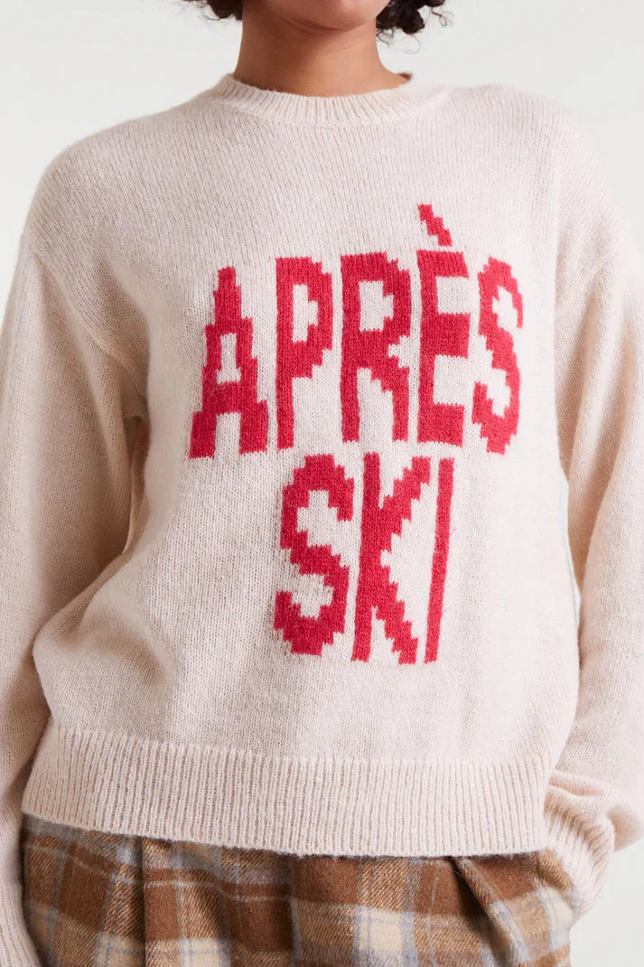 Women's graphic ski sweater with red Après Ski slogan for alpine holidays and cozy winter weekend looks.