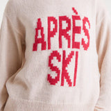 Women's graphic ski sweater with red Après Ski slogan for alpine holidays and cozy winter weekend looks.