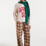 Women's ivory Après Ski pullover sweater with bold red lettering for fashionable ski lodge and chalet outfits.