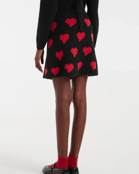Black heart print mini skirt for women featuring bold red hearts and a flattering A-line shape for playful statement outfits.