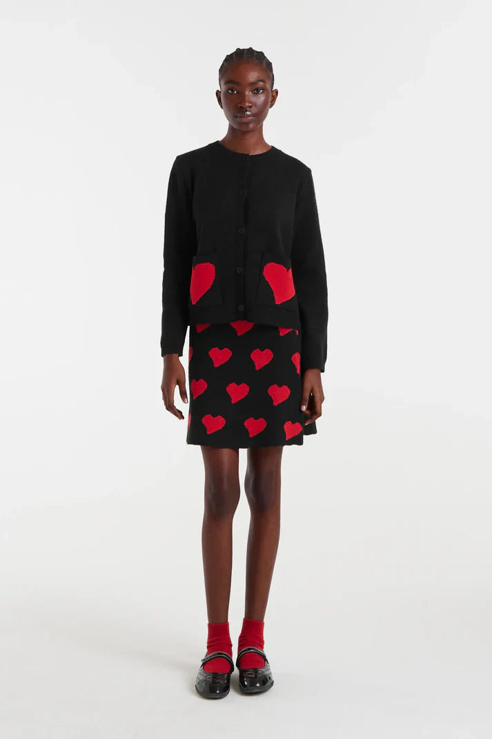 Chic women’s black skirt with oversized red heart graphic pattern