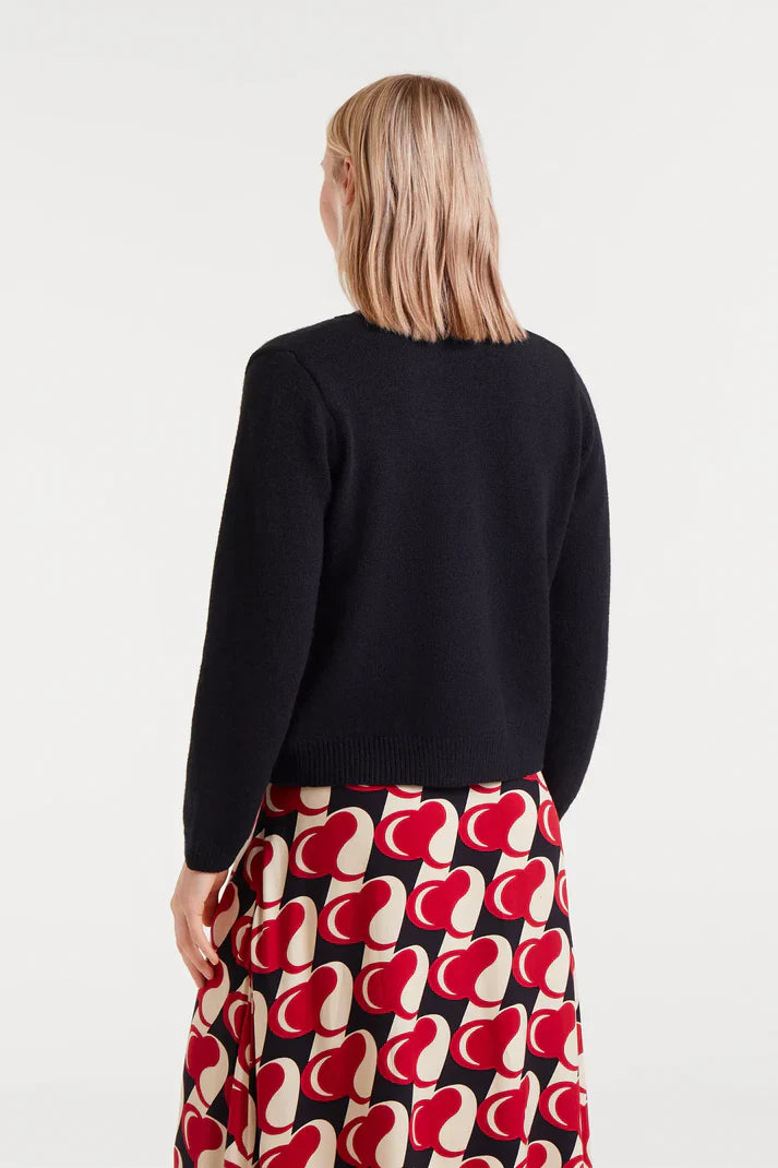 Back view of casual chic women’s cardigan styled with playful Valentine-inspired aesthetic