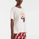 Trendy women’s graphic T-shirt featuring a cute dog design, white crew neck, and relaxed short-sleeve silhouette.