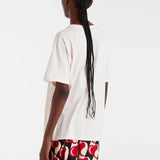 Women’s relaxed-fit white graphic T-shirt with playful dog illustration for animal lovers and casual outfits.