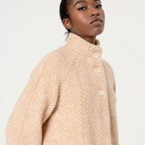 Minimalist herringbone beige midi coat with high neckline and polished timeless outerwear boutique fashion appeal.