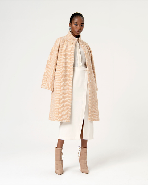 Trendy women’s wool-look coat with soft herringbone texture and elegant neutral winter outfit inspiration.