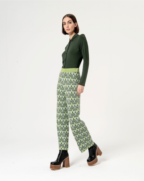 Trendy green and black print trousers featuring artistic geometric design and contemporary urban fashion vibe.