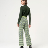 Women’s cropped geometric pants paired with platform ankle boots for trendy street-style inspiration.
