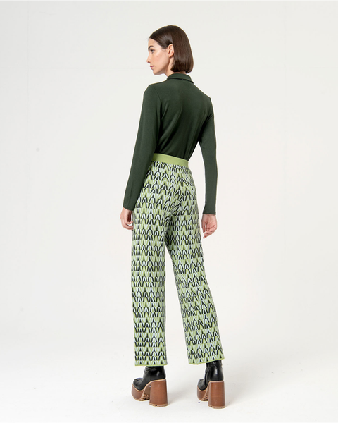 Women’s cropped geometric pants paired with platform ankle boots for trendy street-style inspiration.