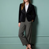 Women’s fitted black velvet jacket with structured shoulders for chic dinner, cocktail, and festive outfits.