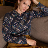 Women's long-sleeve patterned blouse with geometric stripe print, collared neckline and versatile button-front styling