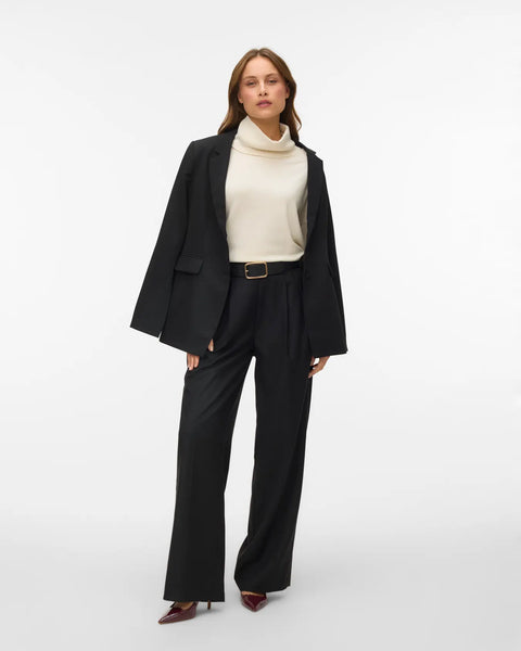 Women's minimalist birch colored roll-neck sweater featuring a relaxed silhouette for versatile work, travel and everyday styling.