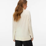 Women's timeless ivory roll-neck sweater with long sleeves and relaxed fit for an elevated capsule wardrobe.