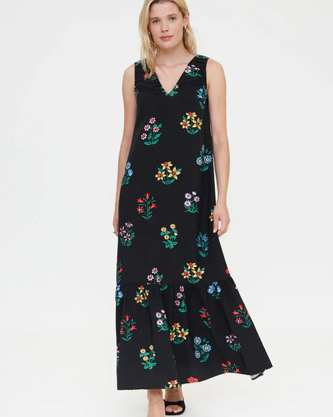 Women's black floral print maxi dress with sleeveless design, colorful botanical pattern and tiered hem for summer vacations and resort style.