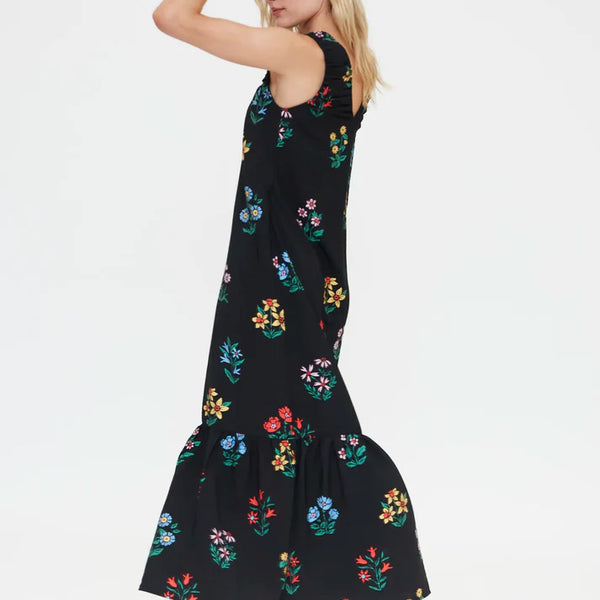 Elegant black sleeveless maxi dress featuring vibrant multicolor floral print, relaxed silhouette and ruffle hem for effortless summer fashion.