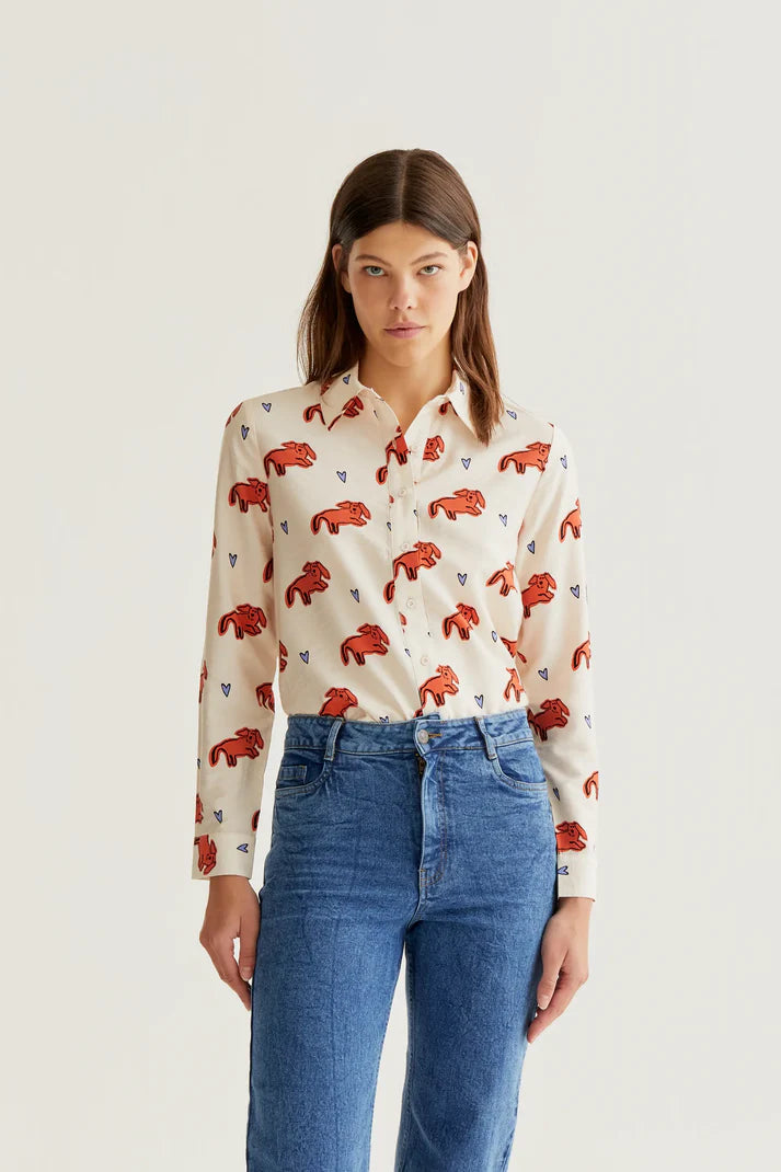 Women's ivory button-up blouse with coral leopard print, blue heart accents and long sleeves for playful boutique fashion and everyday style.