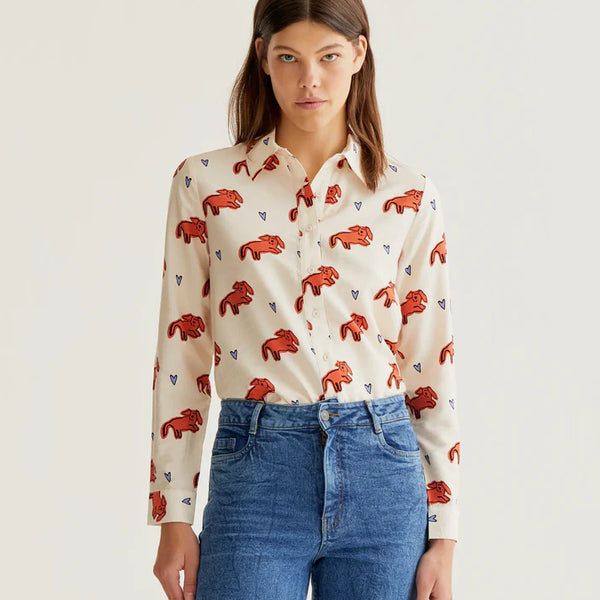 Women's ivory button-up blouse with coral leopard print, blue heart accents and long sleeves for playful boutique fashion and everyday style.