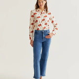 Women's cream printed button-up shirt featuring artistic coral canine illustrations, long sleeves and modern boutique style.