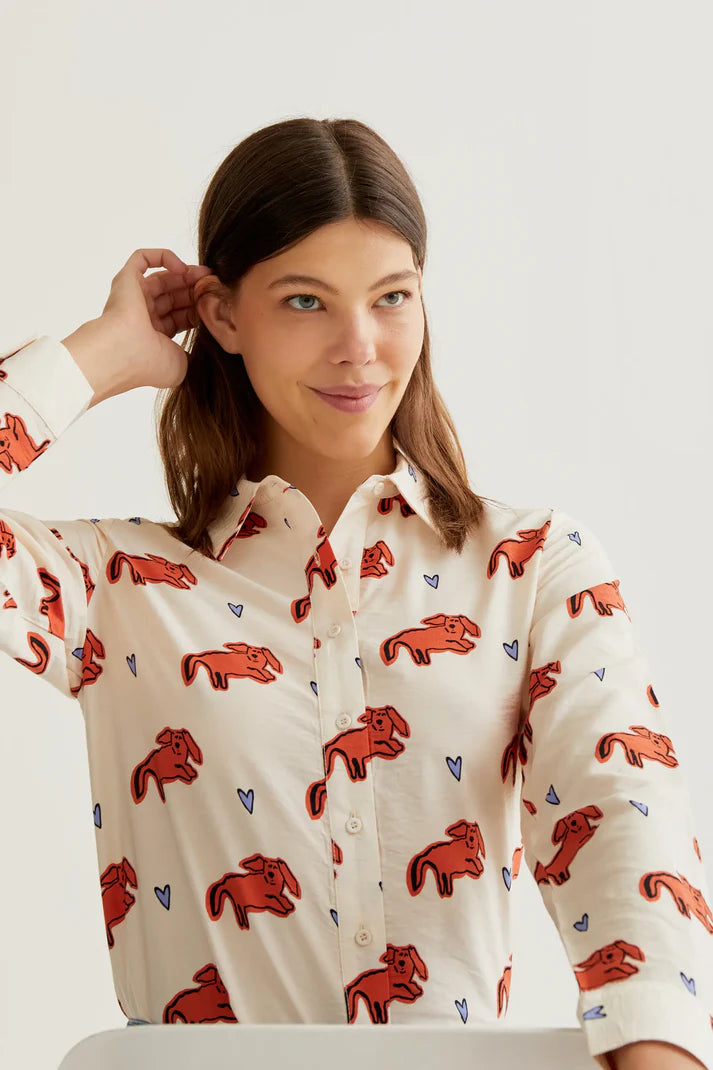 Premium boutique women's collared shirt with whimsical coral animal print, button-front styling and breathable woven fabric for office and casual wear.