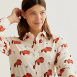 Premium boutique women's collared shirt with whimsical coral animal print, button-front styling and breathable woven fabric for office and casual wear.