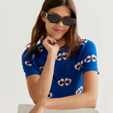 Designer-inspired royal blue casual top with novelty ladybug heart print, crew neck and lightweight construction for playful boutique wardrobes.