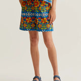 Women's blue retro floral print shorts with colorful botanical pattern, side pockets and relaxed fit for summer vacations and resort style.