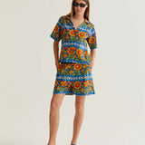 Women's retro flower print shorts featuring a bright botanical design, casual fit and side pockets for vacation and festival outfits.