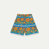 Women's colorful floral resort shorts with a retro daisy print, pull-on comfort and side pockets for beach days, travel and casual summer outfits.