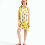 Women's resort dress featuring an all-over fish and pitcher print, collared neckline, and flowy ruffle hem for summer vacations.