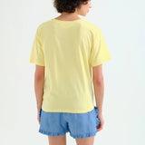 Contemporary graphic cotton tee showcasing modern abstract chair artwork with rolled sleeves and relaxed casual styling.