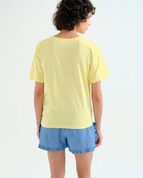Contemporary graphic cotton tee showcasing modern abstract chair artwork with rolled sleeves and relaxed casual styling.