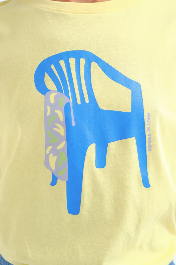 Women's minimalist graphic T-shirt with oversized blue chair design, breathable fabric, and comfortable loose fit for everyday outfits.