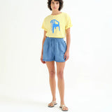 Soft cotton graphic T-shirt with modern blue print, oversized silhouette, and contemporary casual styling for spring and summer.