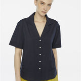 Sophisticated navy blouse designed for effortless styling from workday to weekend.
