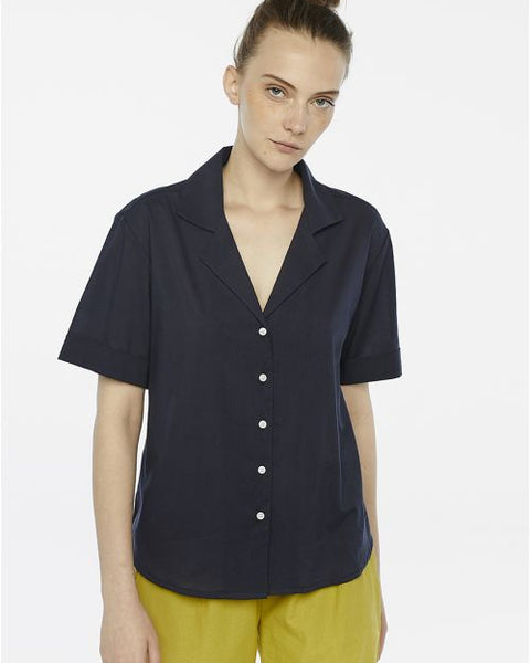 Sophisticated navy blouse designed for effortless styling from workday to weekend.