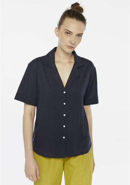 Sophisticated navy blouse designed for effortless styling from workday to weekend.