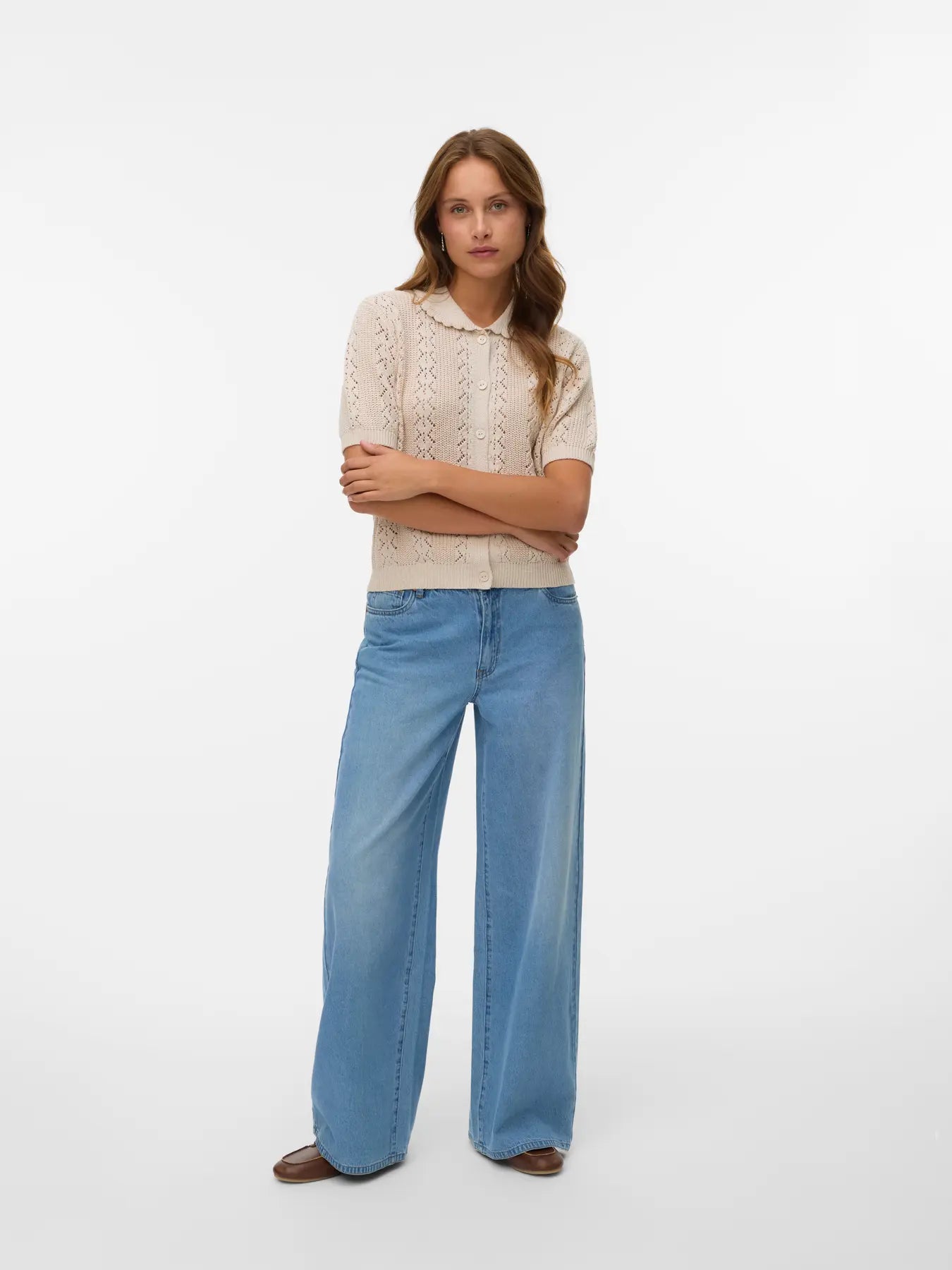 Elegant oatmeal short sleeve knit cardigan featuring delicate pointelle detailing, scalloped collar and classic button-front styling.