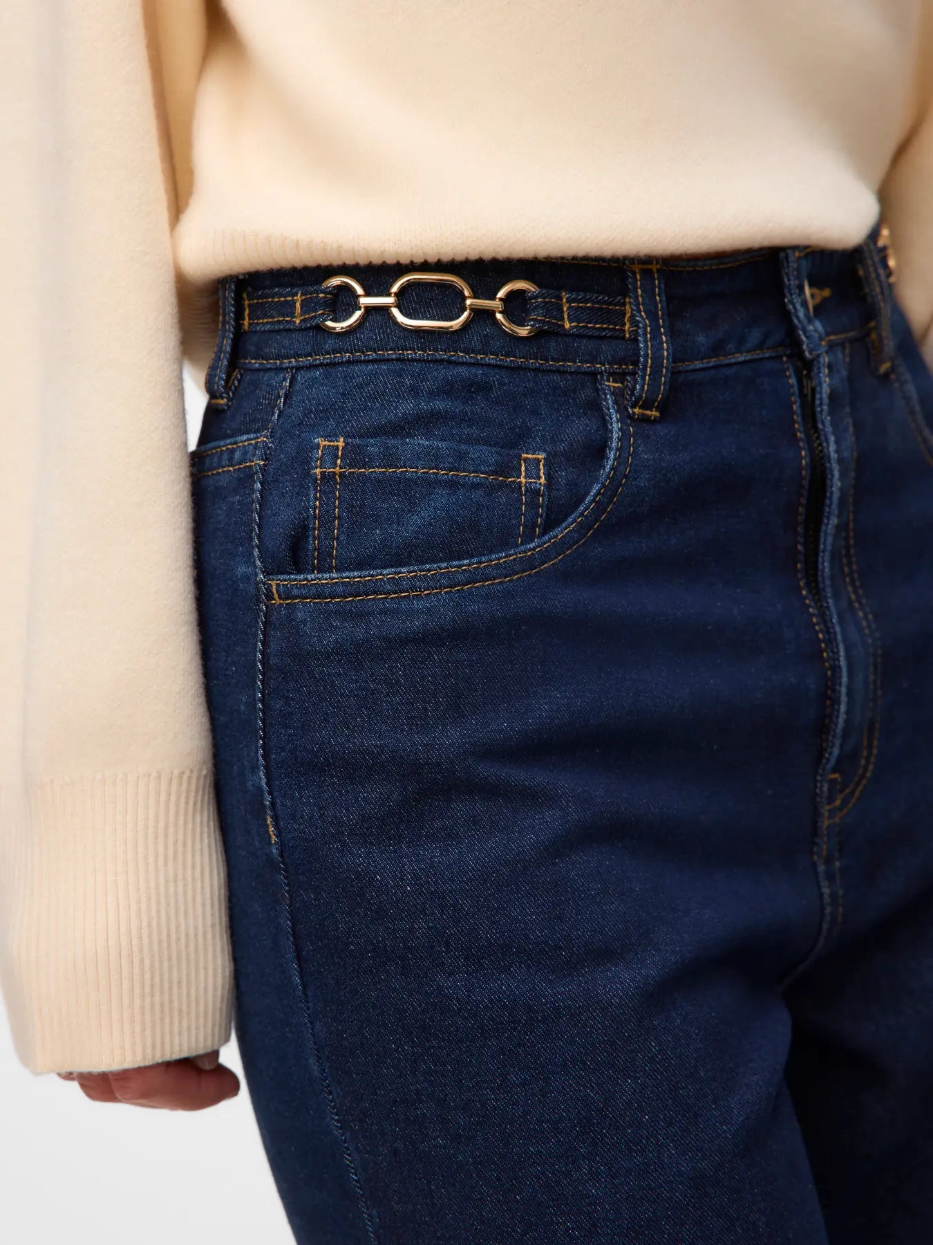 Women's high-waisted dark indigo wide-leg jeans with contrast stitching and full-length relaxed fit for everyday styling.