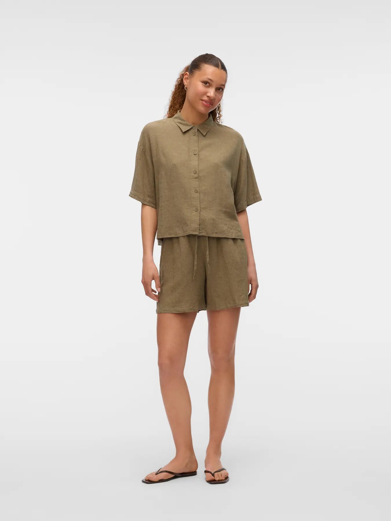 Boutique women's olive woven blouse with classic collar, short sleeves and breathable linen-blend fabric for effortless capsule wardrobe dressing.
