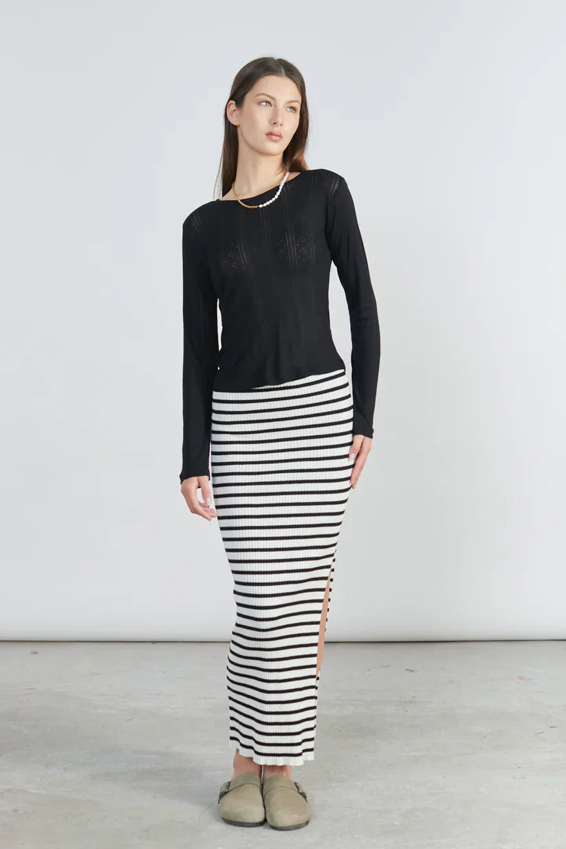 Chic striped bodycon skirt with side slit detail and contemporary Scandinavian-inspired fashion vibe.
