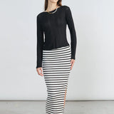 Chic striped bodycon skirt with side slit detail and contemporary Scandinavian-inspired fashion vibe.