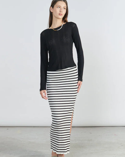 Chic striped bodycon skirt with side slit detail and contemporary Scandinavian-inspired fashion vibe.