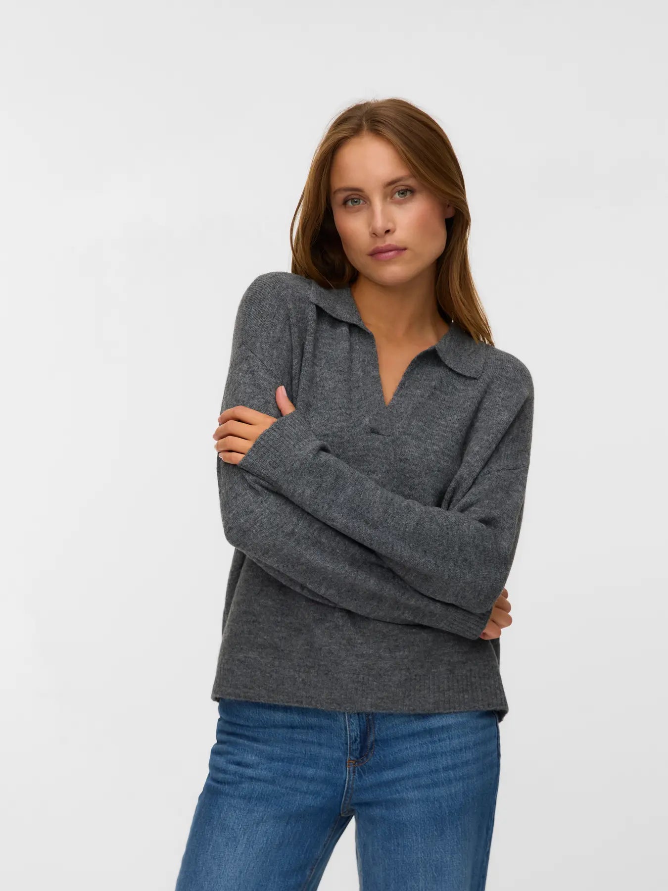 Women's dark grey long-sleeve polo sweater featuring a soft knit texture and open collar for minimalist smart casual style.