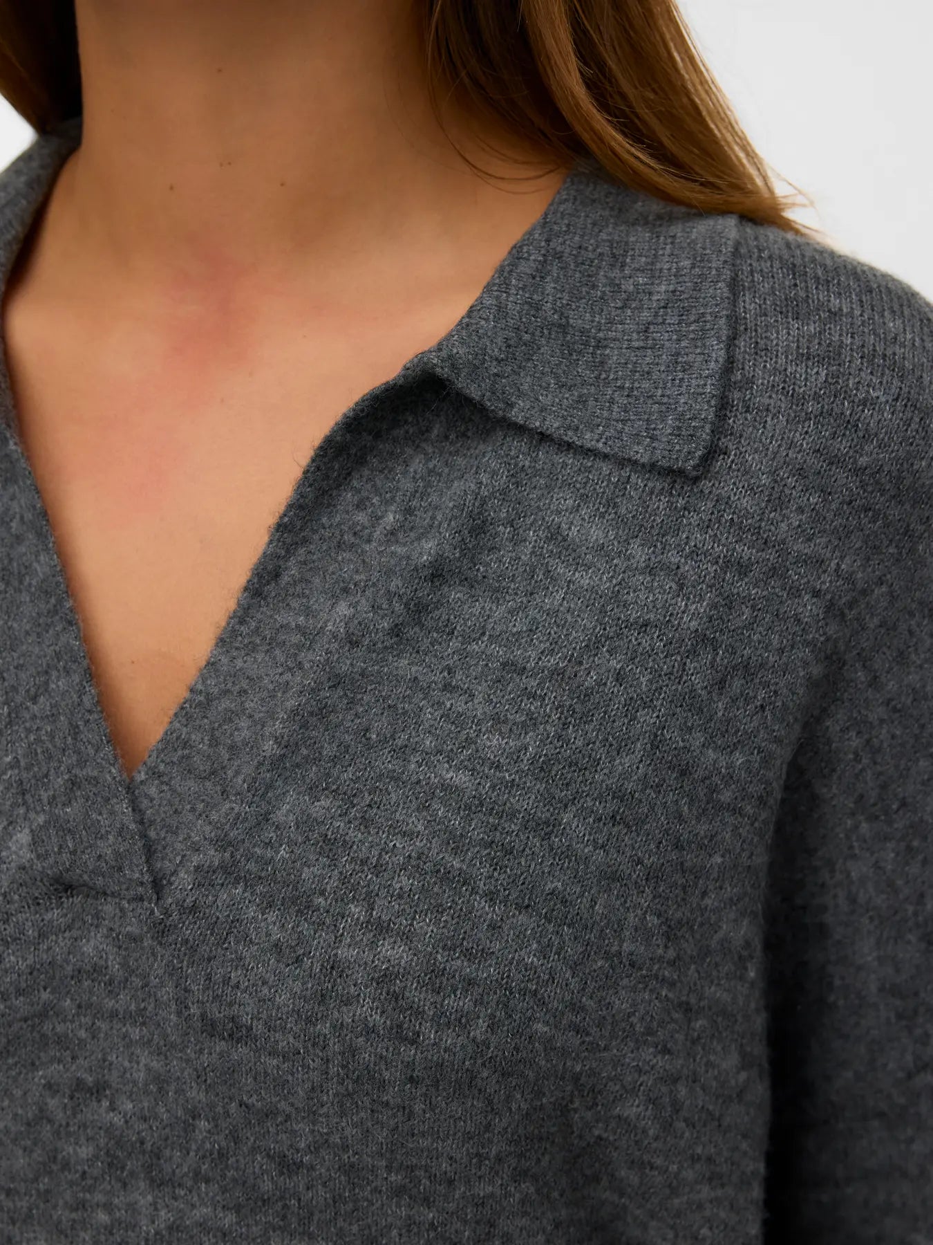 Women's minimalist charcoal grey polo knit sweater with open neckline for a versatile modern capsule wardrobe.
