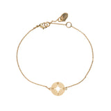 Women’s delicate gold compass rose bracelet with minimalist chain and travel-inspired charm.